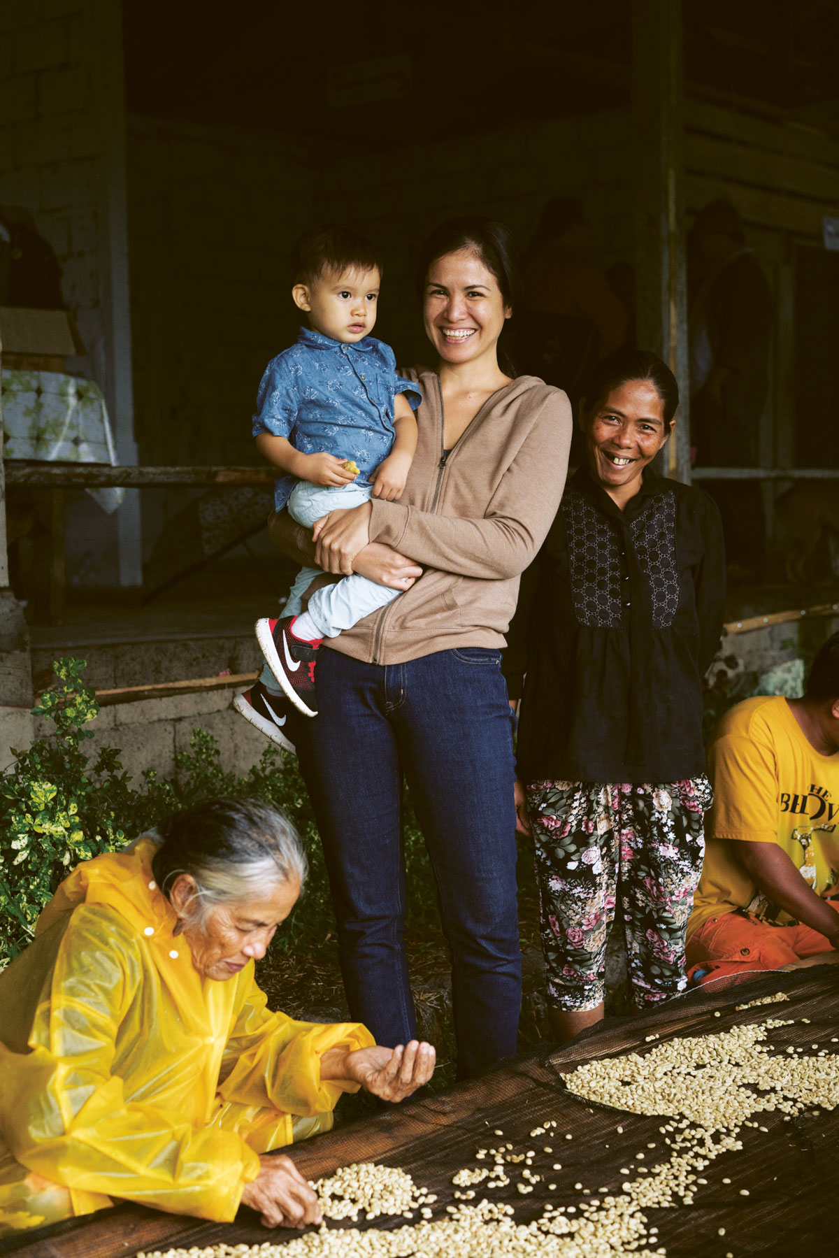 The author, Bea Misa-Crisostomo, with son Pablo and some of the coffee farming community