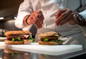 Chef Nicolas Maire prepares a vegetal burger at the headquarters of Swiss group Firmenich, one of the world's leading flavor manufacturers