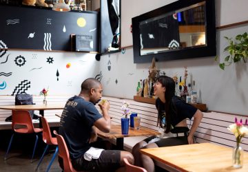 Customers drink and dine inside the restaurant "Martha" after showing proof of their COVID-19 vaccination upon entering in Philadelphia, Pennsylvania, U.S.