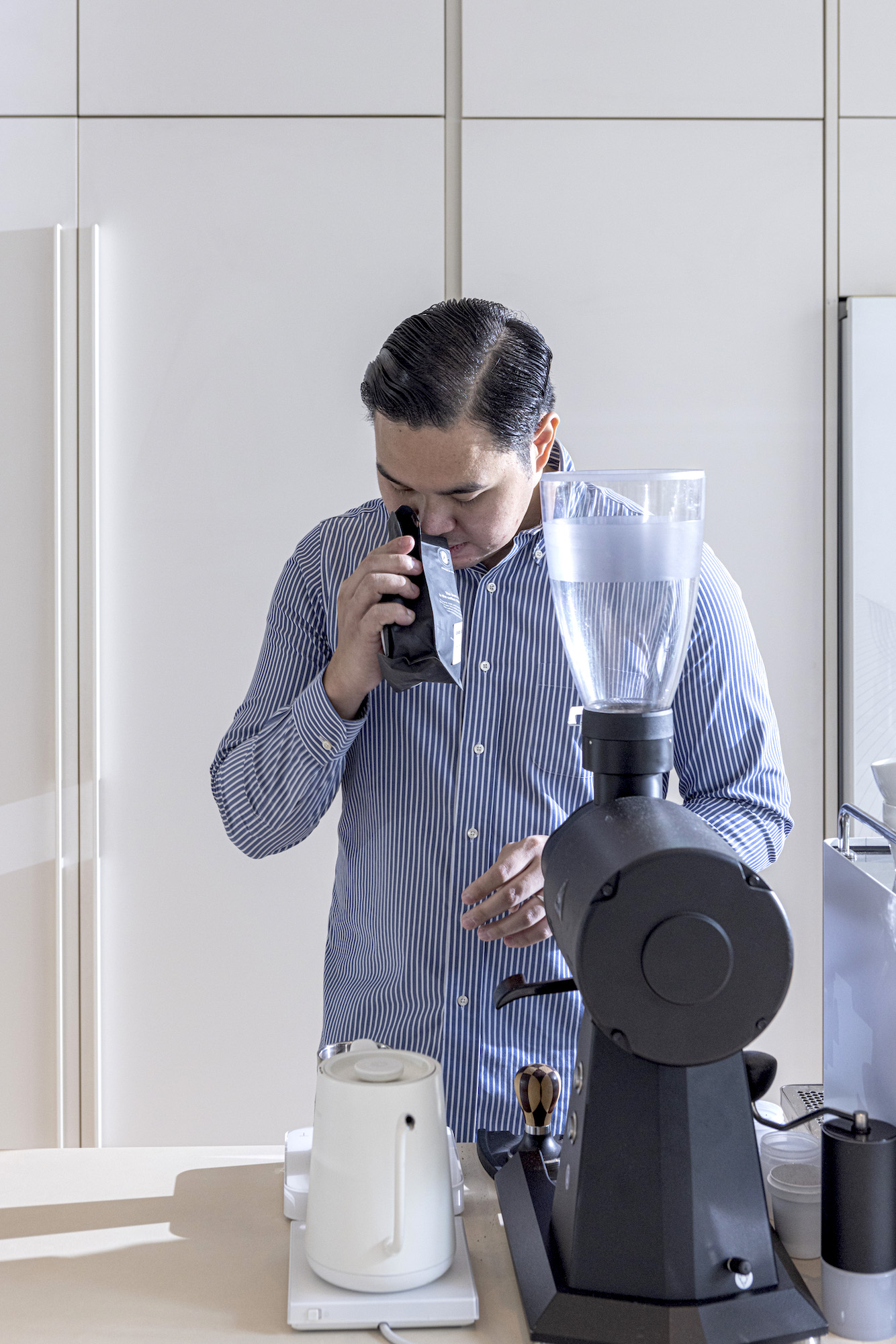 Before every omakase, Gio Visitacion smells the beans of every bag prior to serving