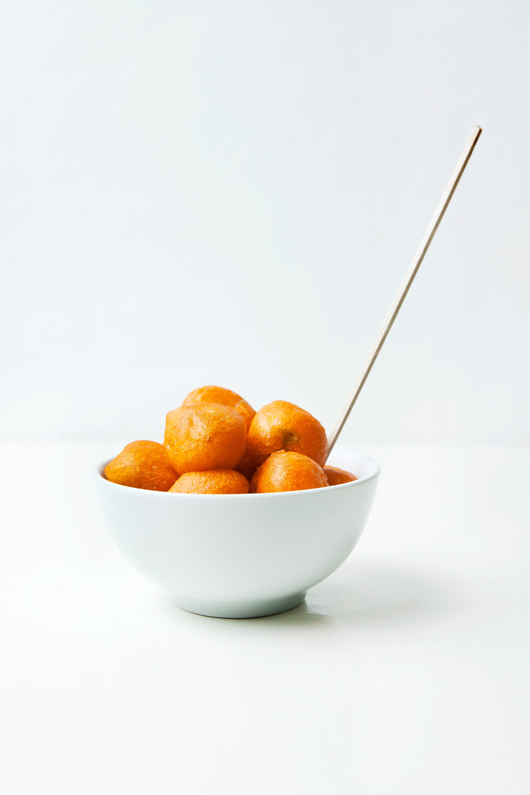 Kwek-kwek or quail egg cooked in orange batter that is made of flour, cornstarch, water, salt, and pepper
