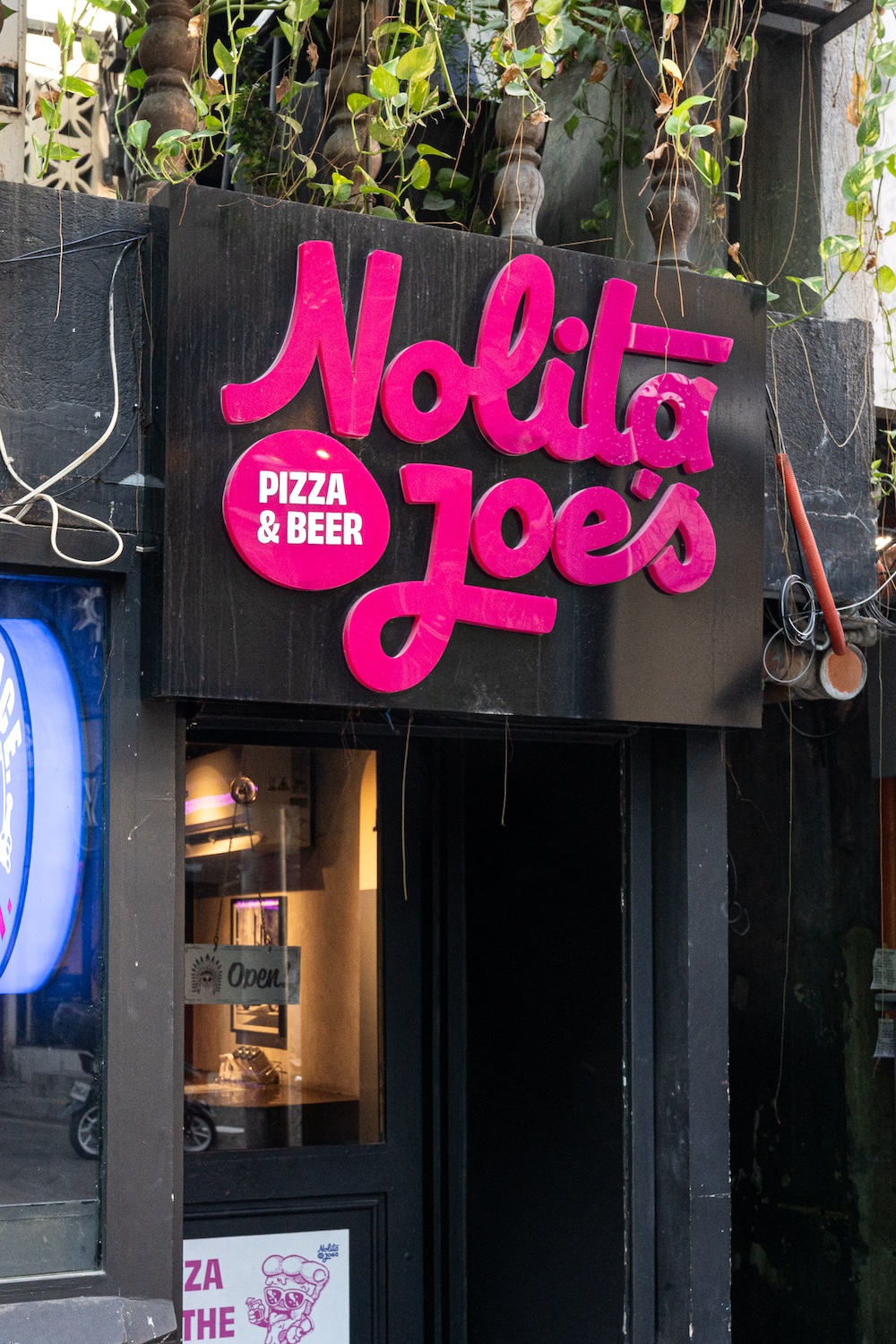 Close-up of the hot pink signage
